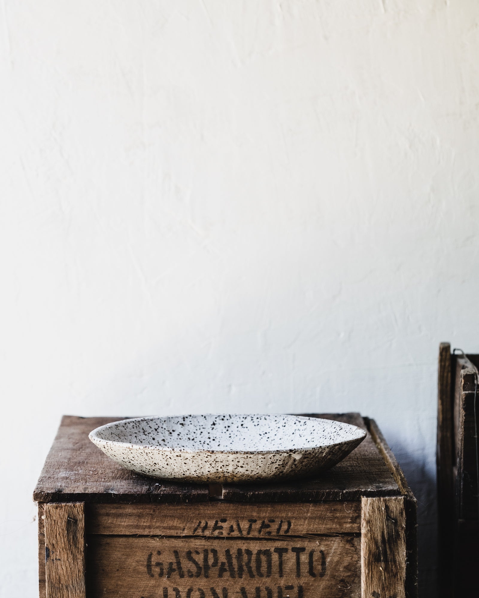 Handmade gritty speckled satin white low wide bowl by clay beehive ceramics