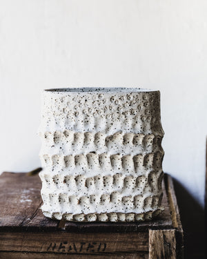 Large oval shaped vessel with textured surface in speckled white finish  by clay beehive ceramics