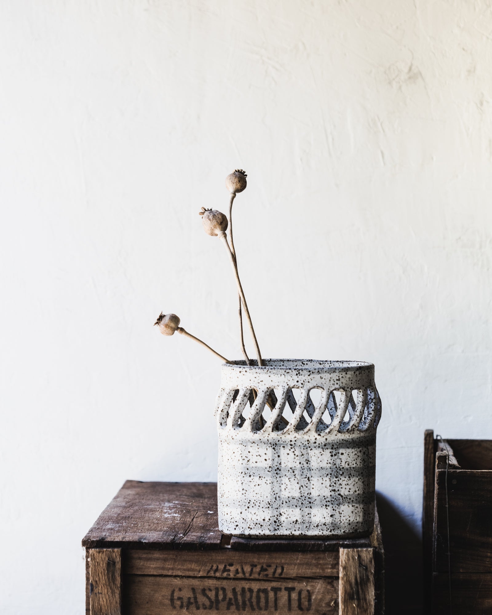 Oval french style vase/vessel with cutouts and tartan speckled white finish by clay beehive ceramics