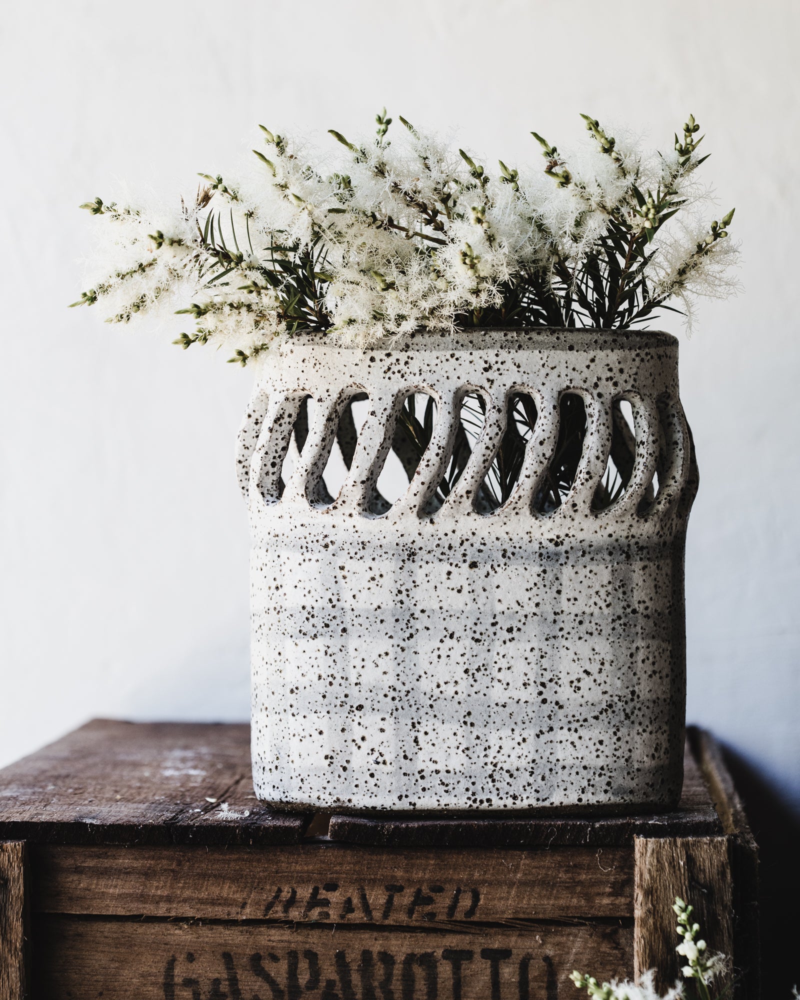 Oval french style vase/vessel with cutouts and tartan speckled white finish by clay beehive ceramics