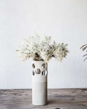 large circles cutout vase in satin white textured finish handmade by clay beehive ceramics