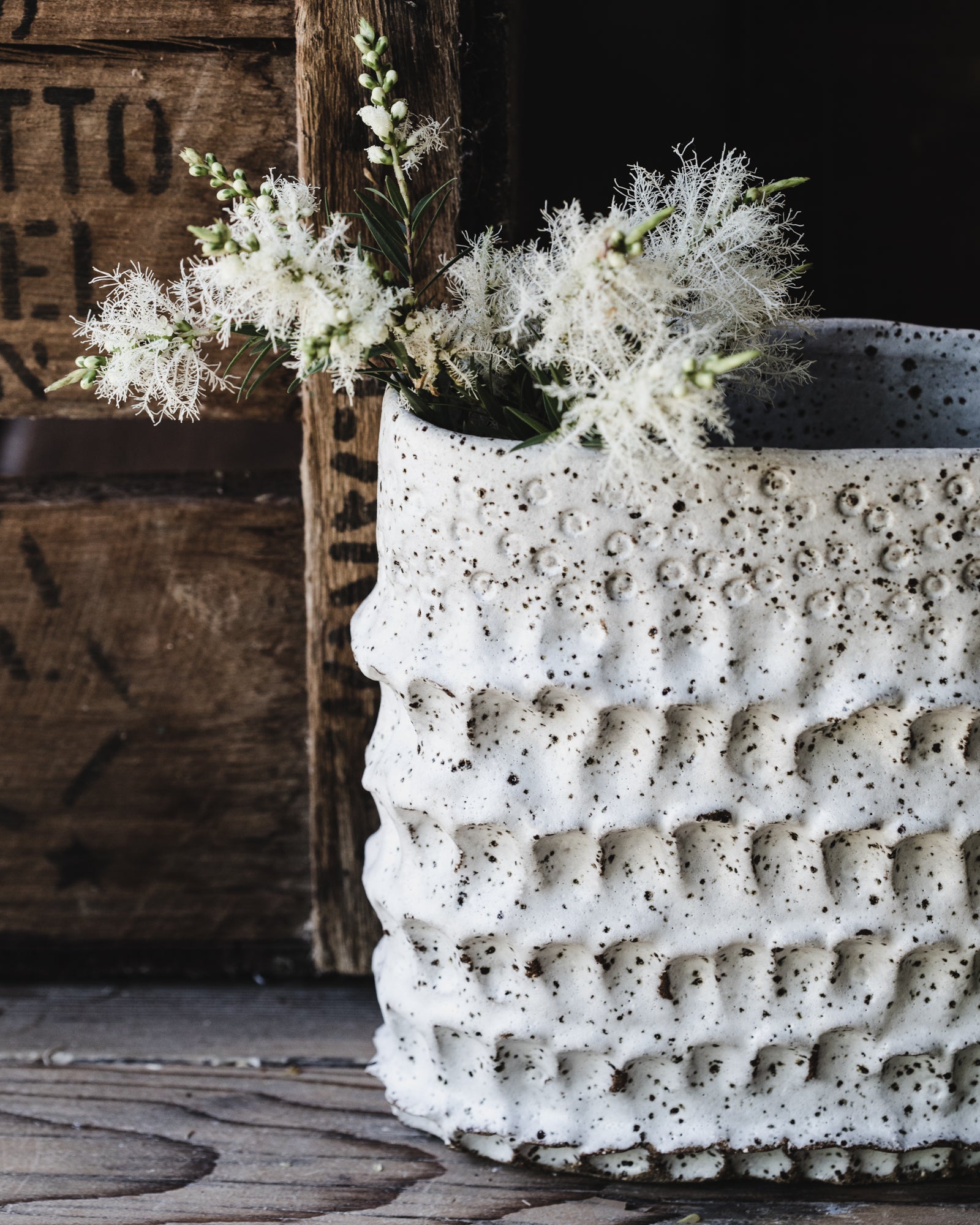 Large oval shaped vessel with textured surface in speckled white finish  by clay beehive ceramics