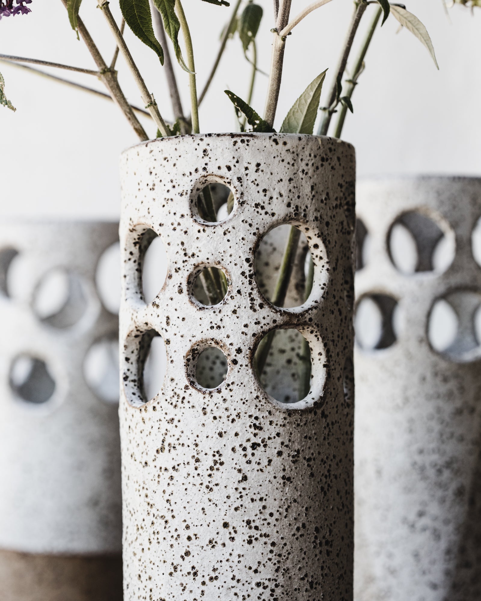 Large rustic cutout circles speckled white vase by clay beehive ceramics
