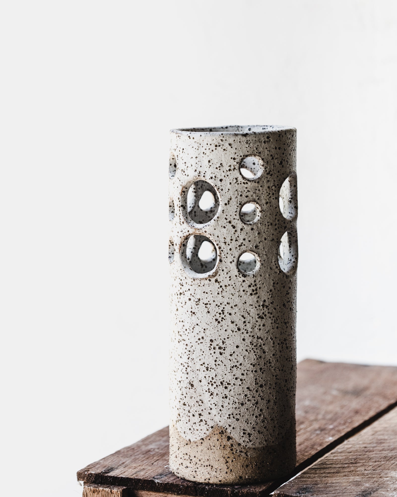 Large rustic cutout circles speckled white vase by clay beehive ceramics