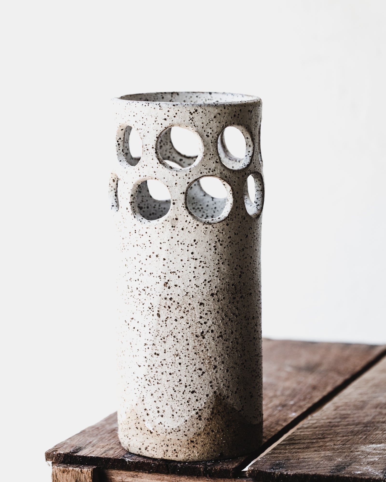 Large rustic cutout circles speckled white vase by clay beehive ceramics