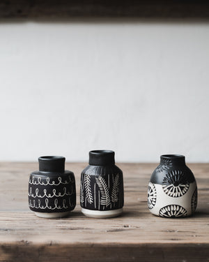 Black and white carved bud vases
