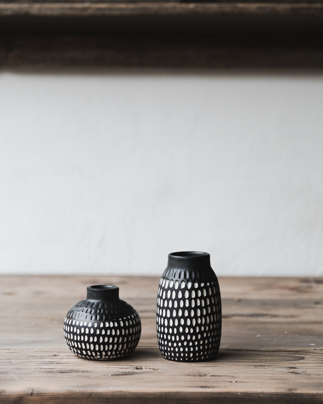 Black and white carved bud vases