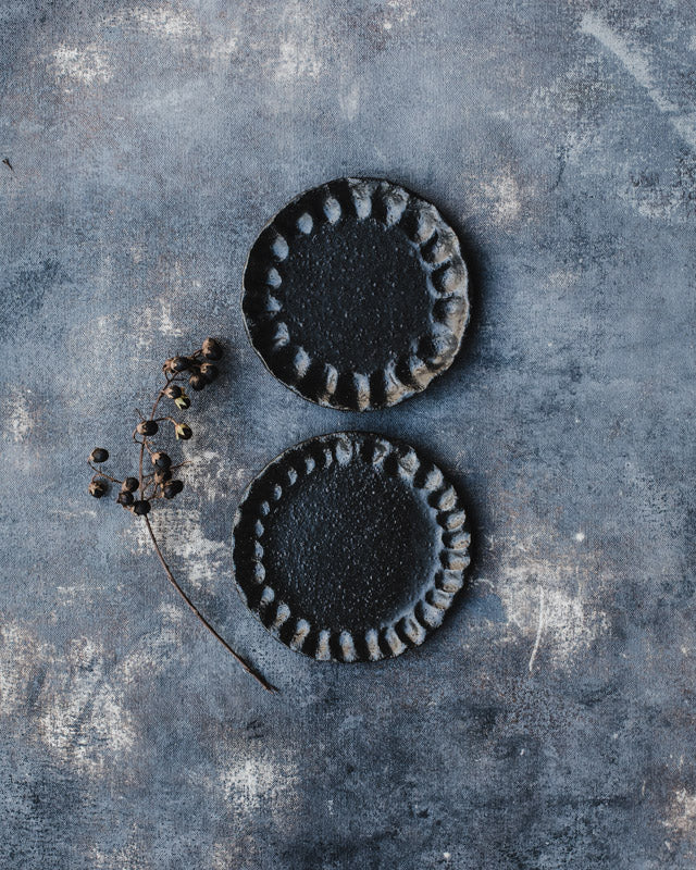 Rustic fluted black snack plates handmade by clay beehive ceramics