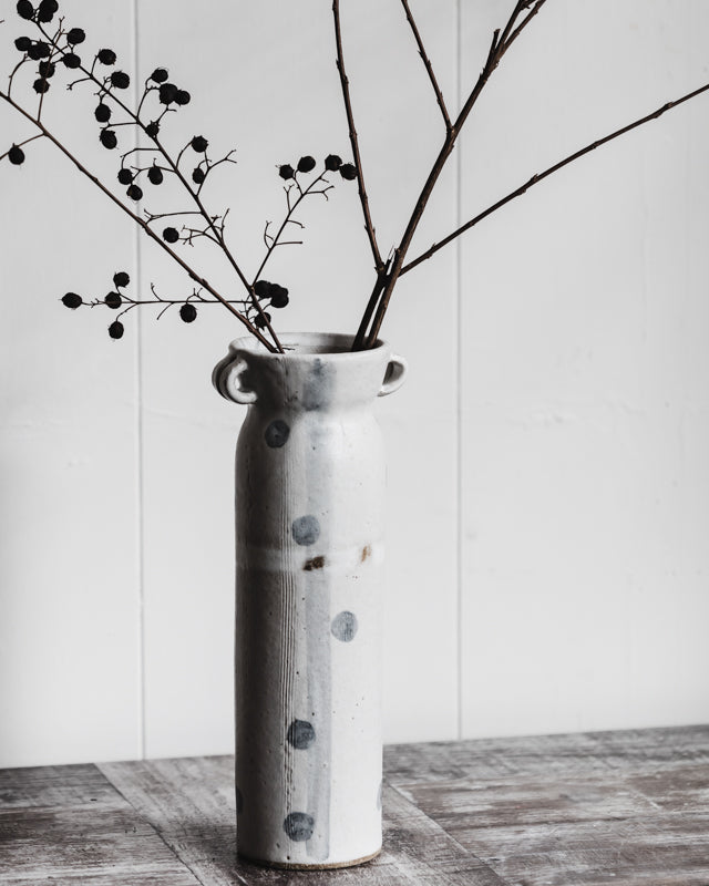Tall ceramic vase with handles decorated with spots and stripes in grey and satin white by clay beehive ceramics
