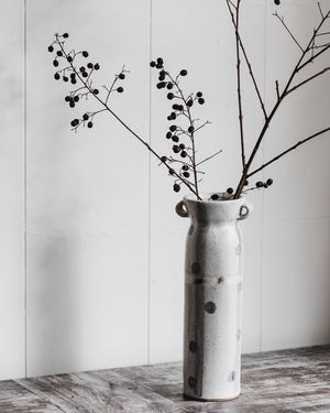 Tall ceramic vase with handles decorated with spots and stripes in grey and satin white by clay beehive ceramics