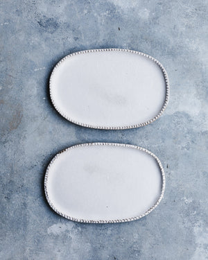 textured rim oval plates with satin white finish by clay beehive ceramics