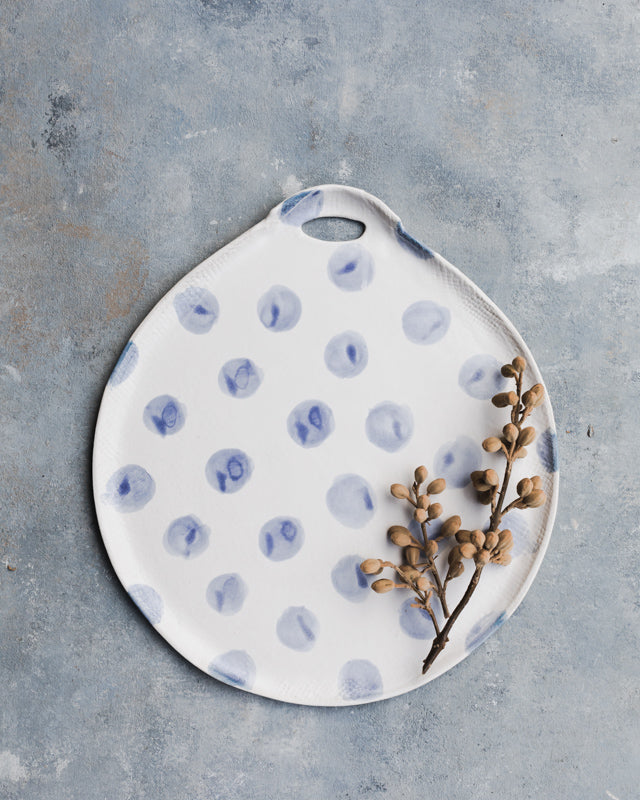 Large blue and white platter with polka dots and handle for easy gripping by clay beehive ceramics