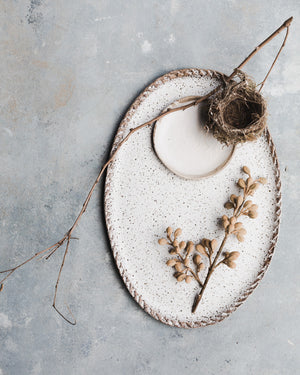 Rustic speckled white oval platter with textured edging by clay beehive ceramics