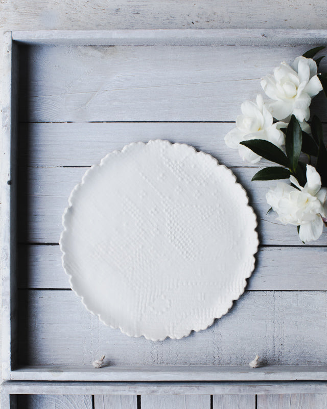 Scalloped rim handmade ceramic plate with textured fabric imprint by clay beehive