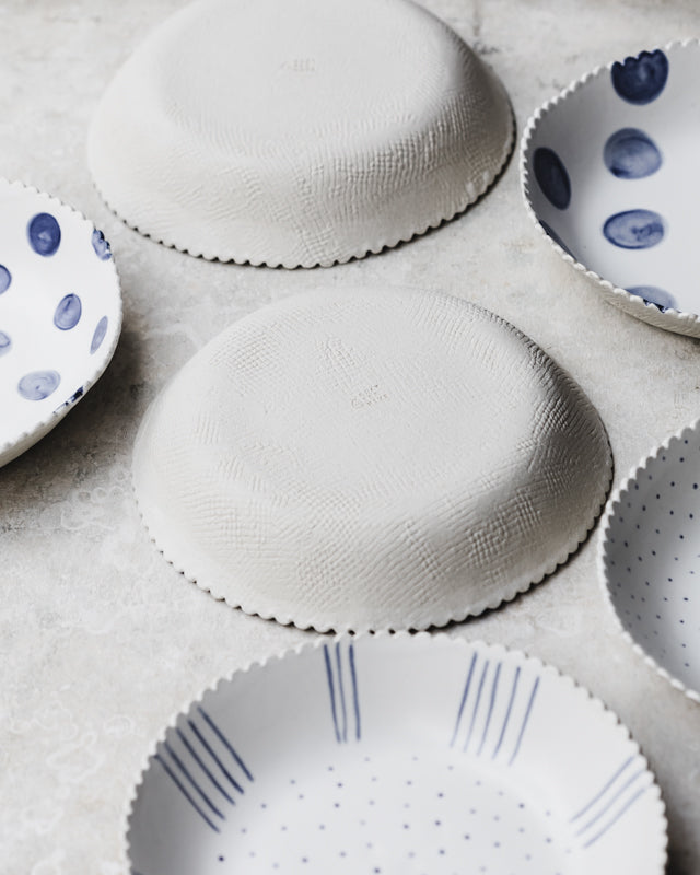 scallop rim large ceramic bowls in blue and white handmade by clay beehive