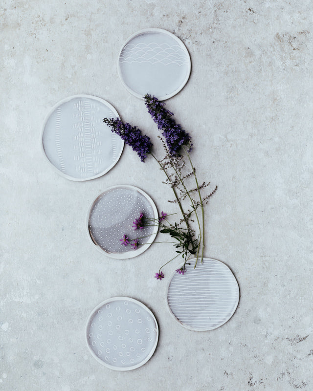 Carved handmade soft grey and white cake plates
