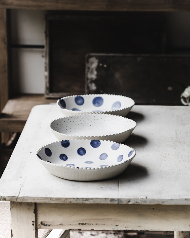 Navy and White large ceramic bowls with a blue spot and fabric textured exterior handmade by Clay Beehive 