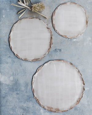 Ceramic plates with lovely organic shaped rim by clay beehive 