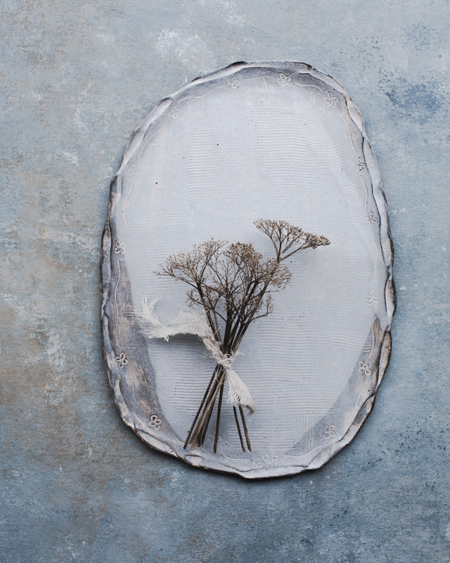 Oval shaped ceramic handmade platter with carved rim in satin white and grey by clay beehive