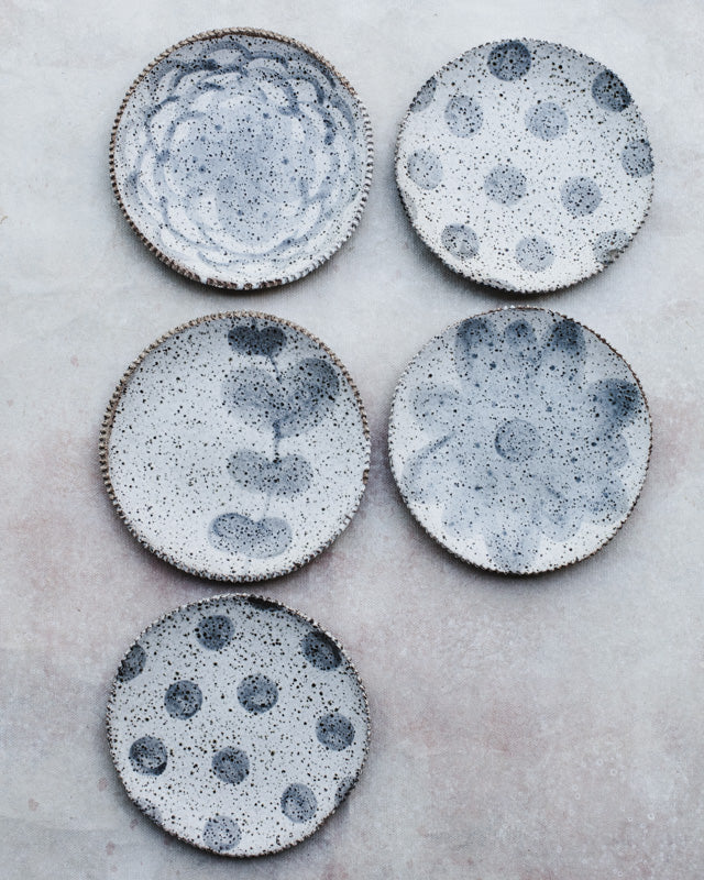 gritty speckled handmade plates with grey/white glaze design by clay beehive