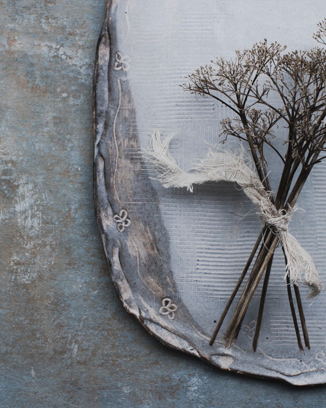 Oval shaped ceramic handmade platter with carved rim in satin white and grey by clay beehive