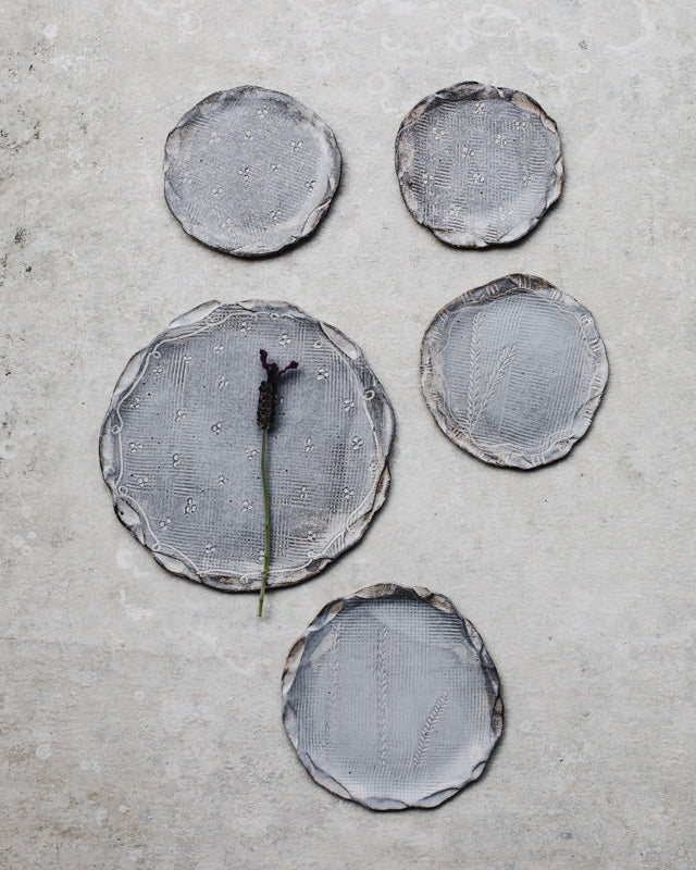 hand made ceramic plates with organic rims by clay beehive
