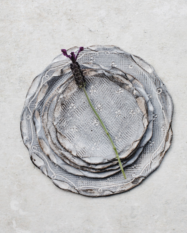 hand made ceramic plates with organic rims by clay beehive