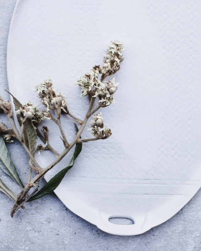 Large satin white platter with textured surface and cut out handles perfect for entertaining by clay beehive