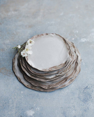 earthy organic shaped rim with satin white glazed plates by clay beehive ceramics