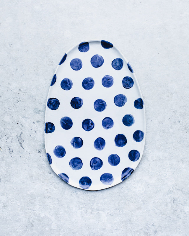 navy blue polka dot oval platter with satin finish by clay beehive ceramics