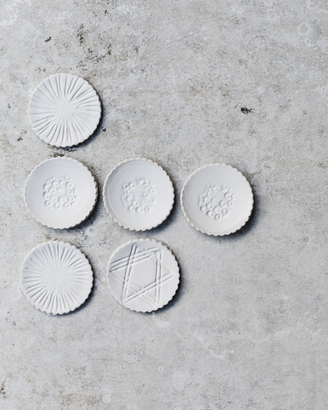 tiny hand made plates in satin white and scallop rims by clay beehive ceramics