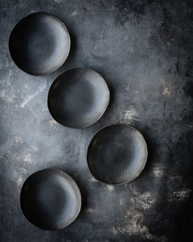 Organic shaped bowls finished in a soft satin matte black glaze