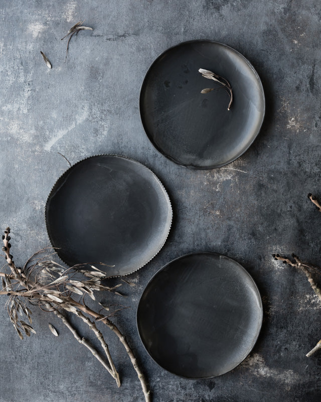 Bowls with a satin matte charcoal glaze and organic shape
