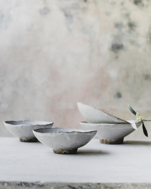 Footed matte white stoneware bowls handmade by clay beehive ceramics