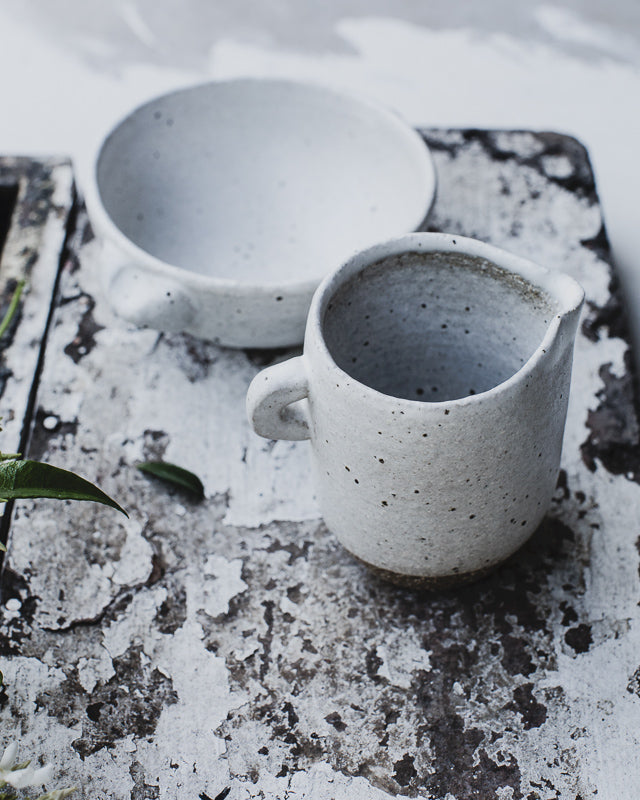 jug and bowl hand crafted out of dark stoneware wheel thrown pottery by clay beehive