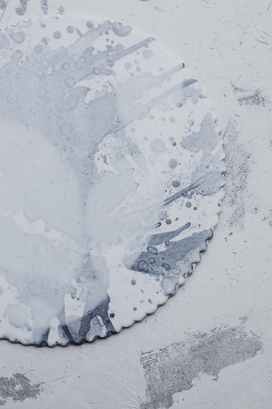 Large ceramic platter with detailed rim scallop in a variety of grays by clay beehive ceramics