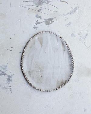 Oval rustic ceramic plates with textured edging and satin white glaze created by clay beehive ceramics