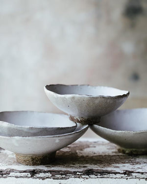 Footed matte white stoneware bowls handmade by clay beehive ceramics