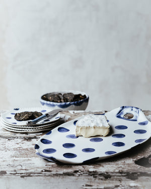navy blue polka dot oval hand made ceramic platter with handles and perfect as a cheese board by clay beehive