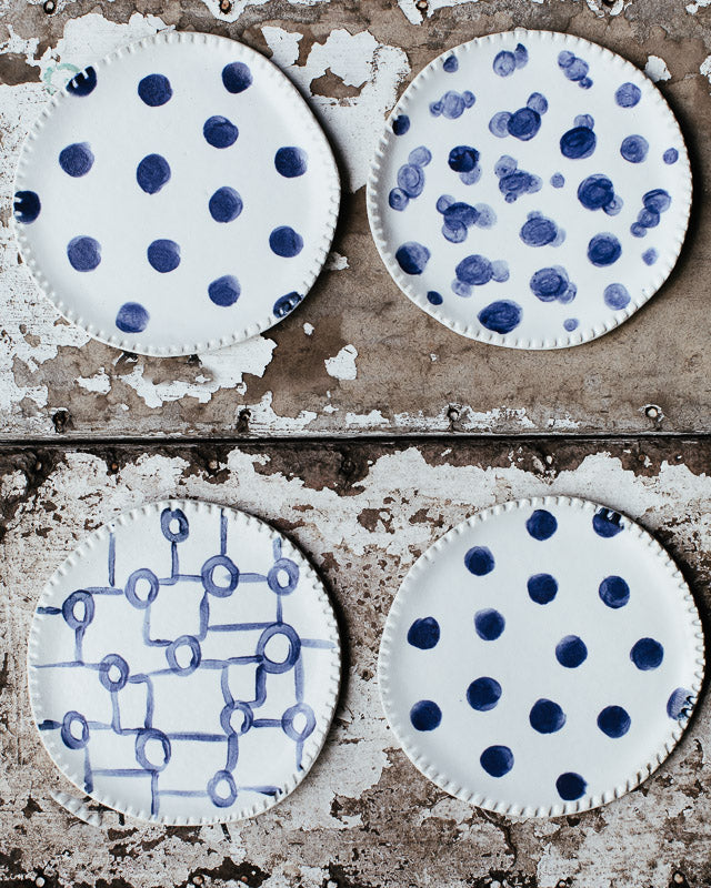 ceramic hand made plates in blue and white satin glaze with textured rim