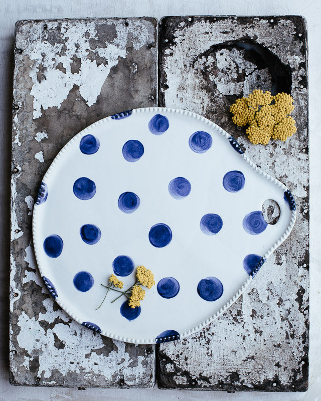 large navy blue polka dot platter plate perfect as a cheeseboard or cake plate handmade by clay beehive ceramics