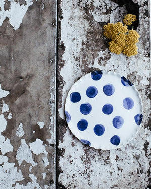 navy blue polka dot plate perfect for cakes hand made by clay beehive ceramics in a satin white finish