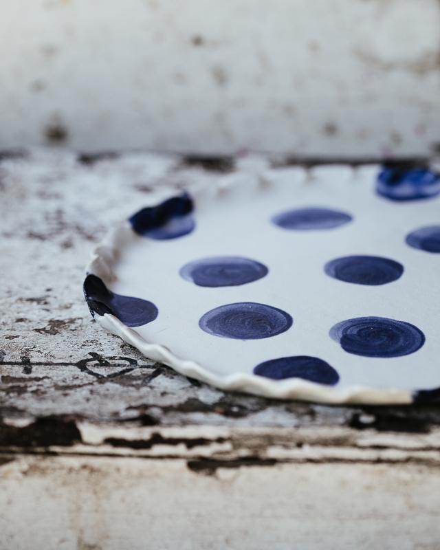 navy blue polka dot plate perfect for cakes hand made by clay beehive ceramics in a satin white finish