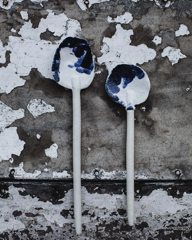 white gritty rustic hand made spoons with navy and white satin glaze by clay beehive ceramics