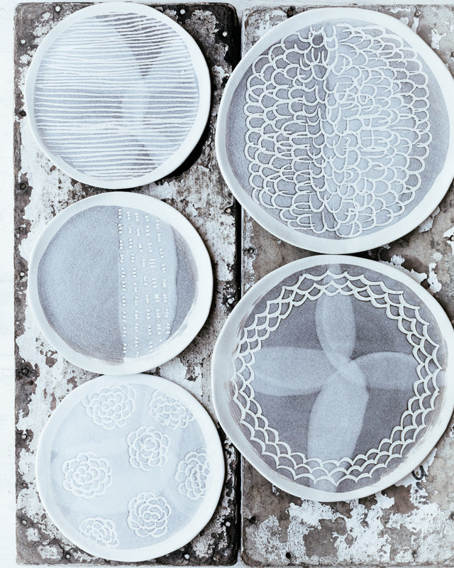 ceramic hand made plate with carved texture and pattern in grey and white matte by clay beehive