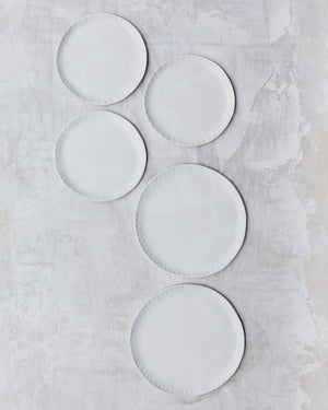 Satin white carved seashell rim plates