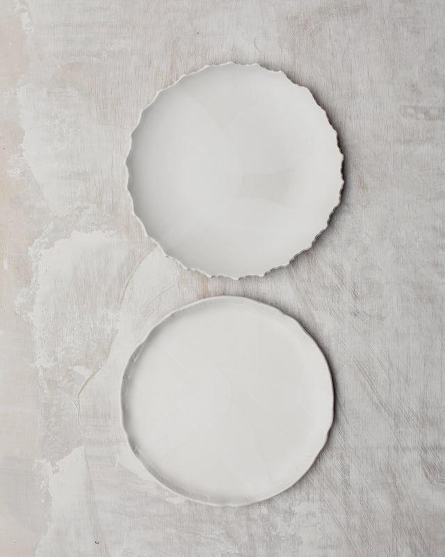 Satin white hand made plates with decorative rims by clay beehive ceramic