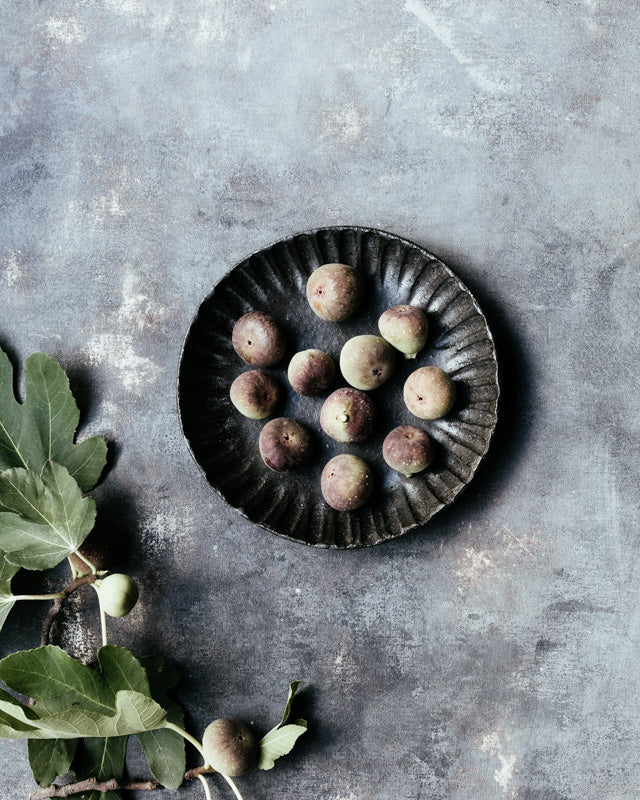 gritty fluted/carved black hand made ceramic bowl by clay beehive