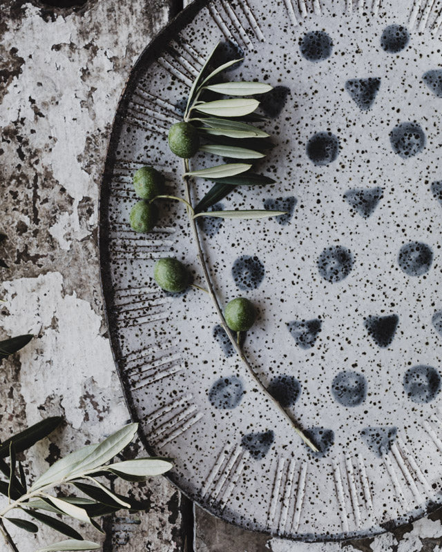 hand made rustic speckled patterned serving platter plate with spots and triangles by clay beehive