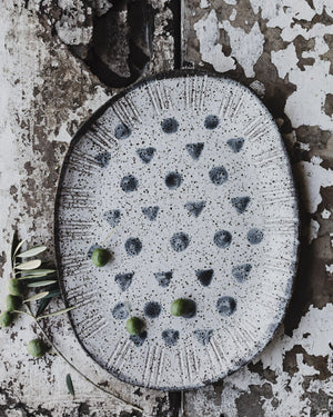 hand made rustic speckled patterned serving platter plate with spots and triangles by clay beehive